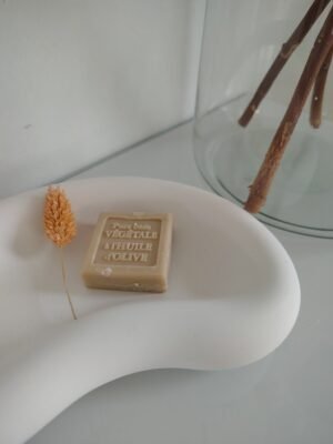 New Page Concrete white kidney shaped decorative bowl with a flower and a piece of soap